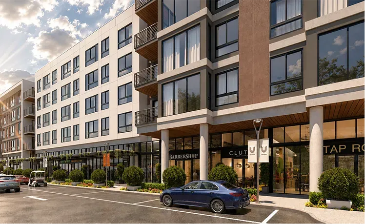 Exterior of The Astrie modern residential building at Uptown Tucson with ground-floor retail shops and dining
